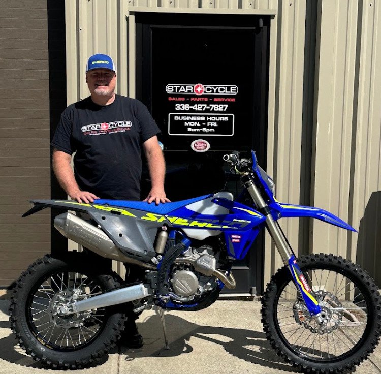 Derek Standing Behind a Sherco SEF 250 Factory